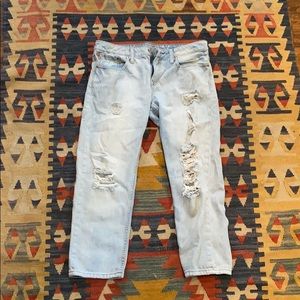 Ripped light denim boyfriend style